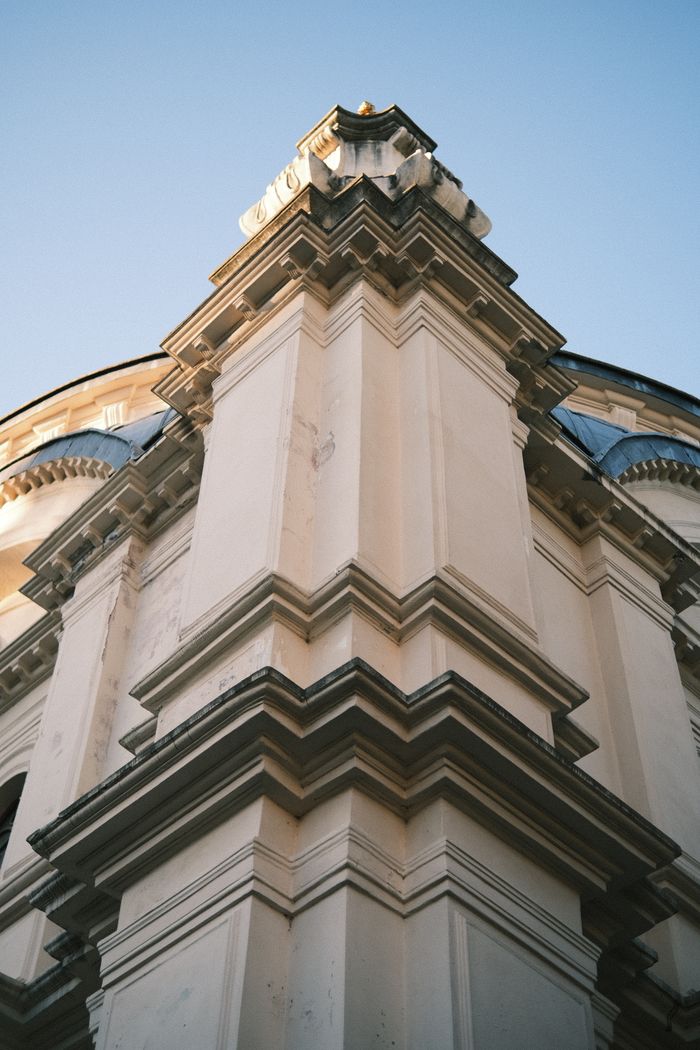 Close-up of a baroque architectural facade showcasing intricate details and symmetry.